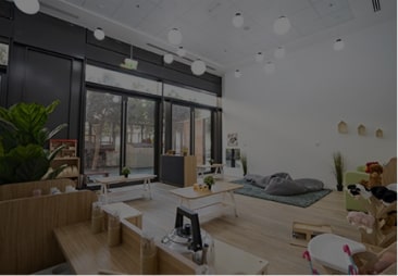 A room with a lot of furniture and plants.