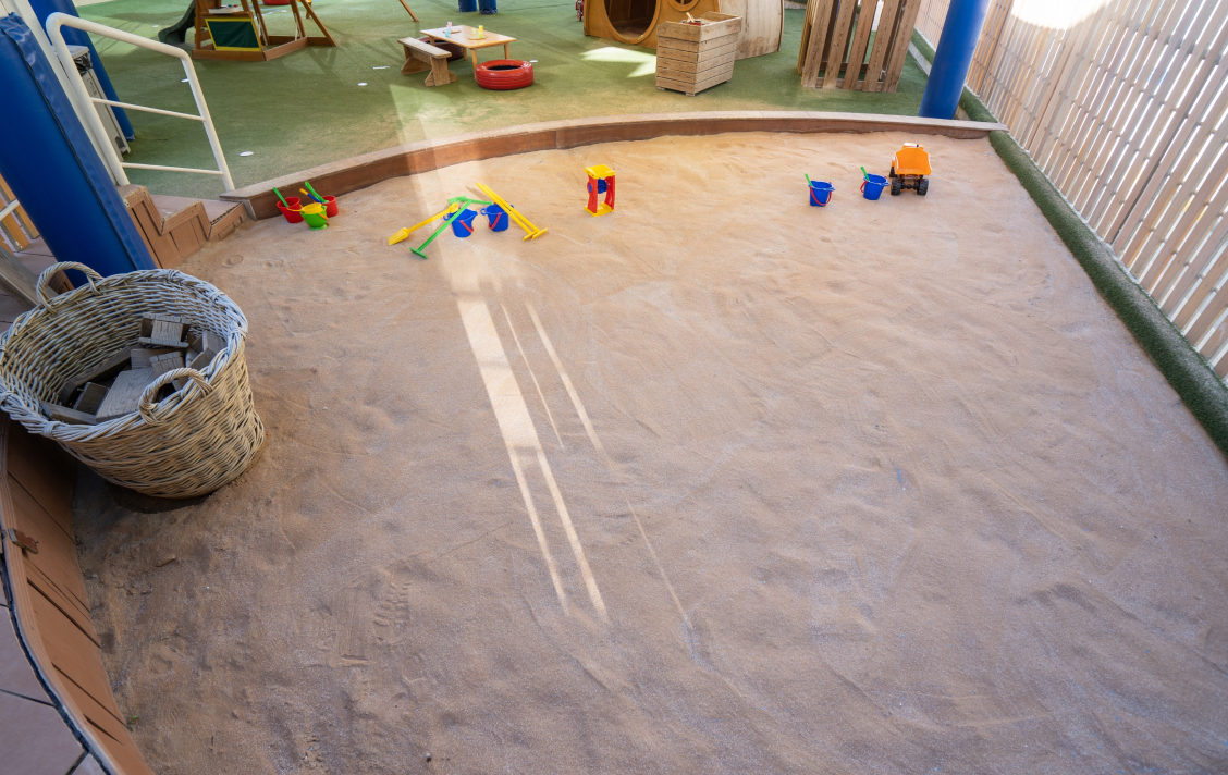 A sand pit in a child's play area.